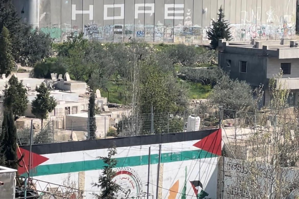 Israels illegal Separation Wall and military watchtowers tower over Aida refugee camp near Bethlehem