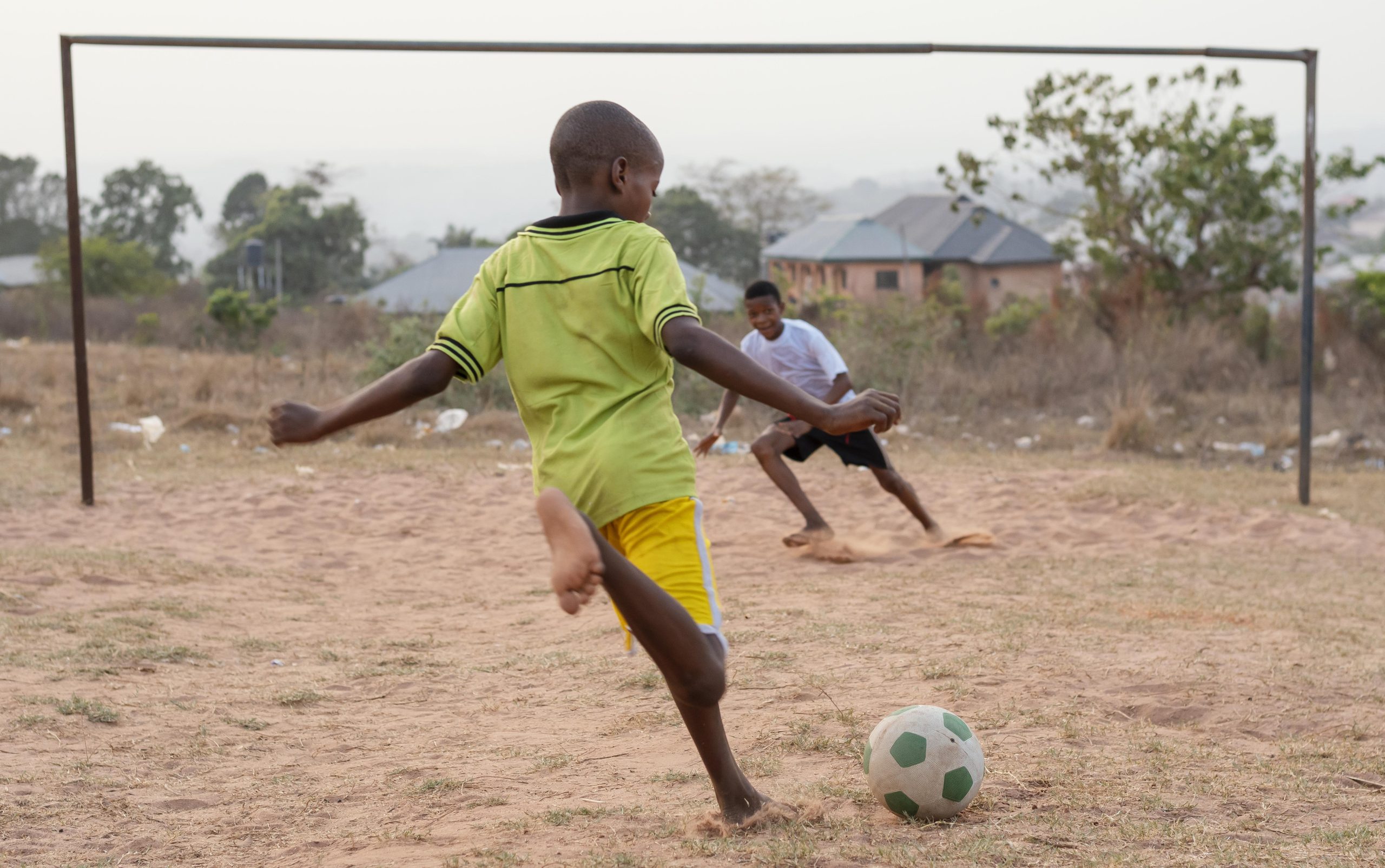 childrens playing football scaled